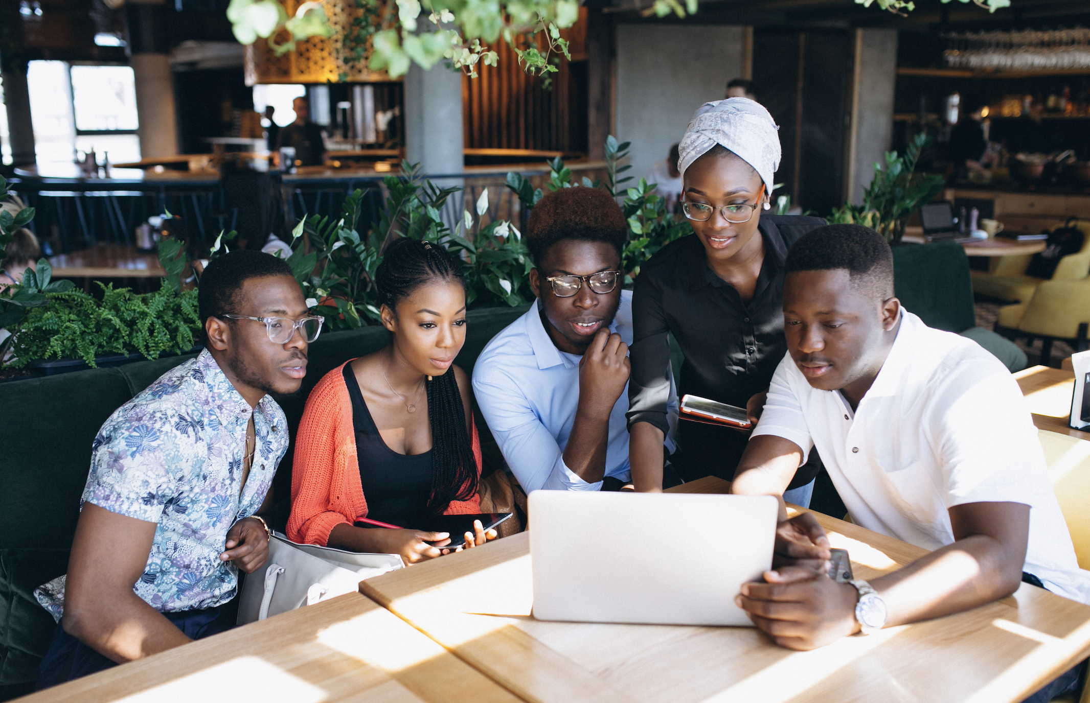 African professionals collaborating on digital solutions